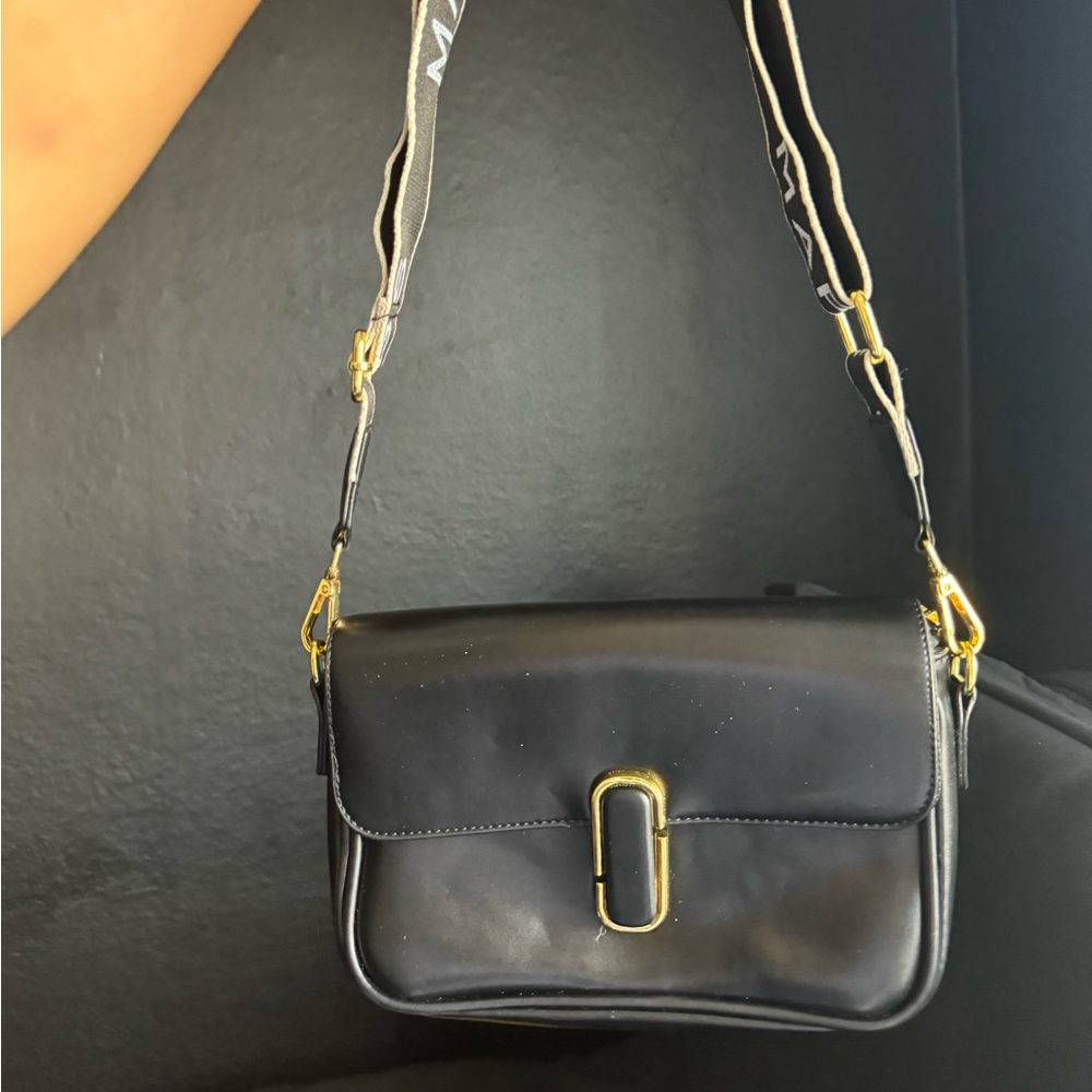 Black and gold mark Jacob’s crossbody purse